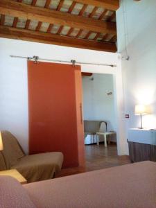 Postel nebo postele na pokoji v ubytování Agriturismo Forestale Luti