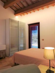 Postel nebo postele na pokoji v ubytování Agriturismo Forestale Luti