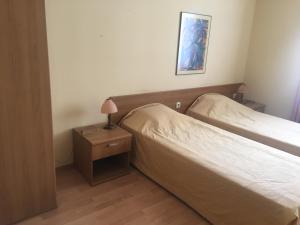 A bed or beds in a room at Hotel Gloria Palace Diplomat