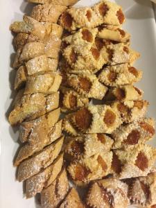 a pile of crackers on a white plate at Hotel Cristall in San Benedetto del Tronto