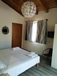 Letto o letti in una camera di I Gelsi e i Castagni