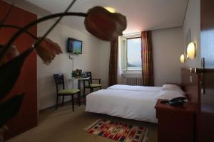 מיטה או מיטות בחדר ב-Piazza Ascona Hotel & Restaurants