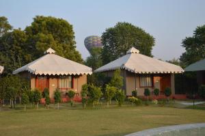 a house with two domes and a hot air balloon at Lohana Village Resort in Pushkar