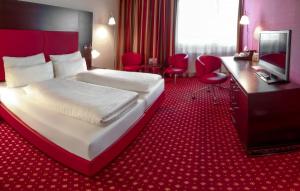 En TV eller et underholdningssystem på Best Western Plaza Hotel Wels