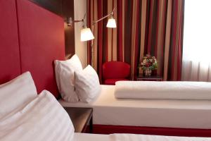 En eller flere senger på et rom på Best Western Plaza Hotel Wels