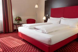 En eller flere senger på et rom på Best Western Plaza Hotel Wels