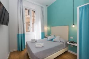 Postelja oz. postelje v sobi nastanitve Amazing Piazza Venezia Suites
