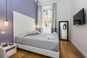 Voodi või voodid majutusasutuse Amazing Piazza Venezia Suites toas