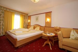 Łóżko lub łóżka w pokoju w obiekcie Altachhof Hotel und Ferienanlage - Jokercard im Sommer inklusive
