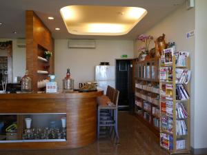 a store with a counter and a book shelf at Da-Tong Vacation Hotel in Chenggong