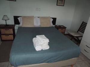 Una cama o camas en una habitación de Casa Di Aqua Apart Hotel