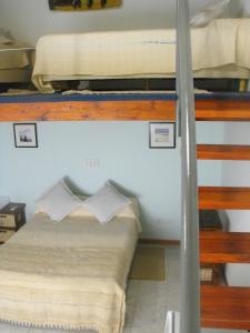 Una cama o camas en una habitación de Casa Di Aqua Apart Hotel
