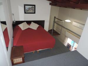 Una cama o camas en una habitación de Casa Di Aqua Apart Hotel