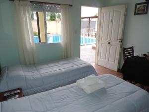 Una cama o camas en una habitación de Casa Di Aqua Apart Hotel