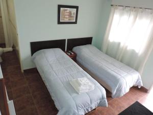 Una cama o camas en una habitación de Casa Di Aqua Apart Hotel