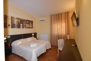 Postel nebo postele na pokoji v ubytování B&B Portacastello