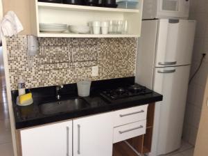 Η κουζίνα ή μικρή κουζίνα στο Condo Ipanema 503 +4 φωτογραφίες