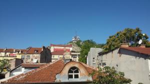 a view of a city with a hill in the background at Guest Rooms Filipopol in Plovdiv