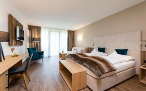 A bed or beds in a room at Rainell Dolomites Retreat
