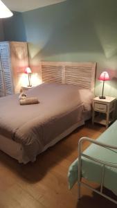 Un pat sau paturi într-o cameră la L'Auberge de Teissières