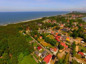 an aerial view of a town next to the ocean at Apartamenty na pięterku in Mielno