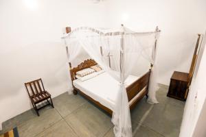 Postel nebo postele na pokoji v ubytování Knight Inn - Galle Fort