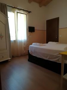 Letto o letti in una camera di I Gelsi e i Castagni