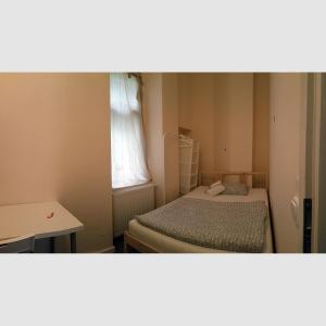 Ein Bett oder Betten in einem Zimmer der Unterkunft Lodgecity - Private Rooms