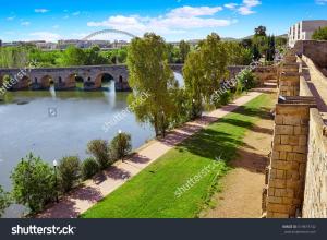 a view of the river tyne with a bridge at Apartamentos Coso de San Albin in Merida