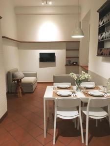 a living room with a white table and chairs at Carlo's B149C - Sanremo Center Suite - da Carlo - in Sanremo