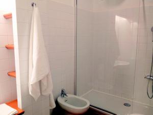 a bathroom with a shower and a toilet and a sink at Carlo's B149C - Sanremo Center Suite - da Carlo - in Sanremo +15 photos