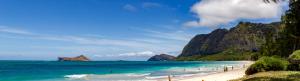 a beach with people on the sand and the ocean at All Inclusive Waimanalo Beachlots, Sleeps 8 in Waimanalo