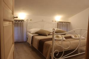Postel nebo postele na pokoji v ubytování Guesthouse Casetta Verde