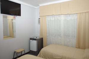 TV a/nebo společenská místnost v ubytování Rioma Hotel