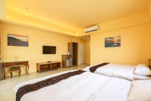 Postel nebo postele na pokoji v ubytování Bo Heng B&B