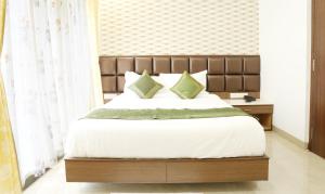 Letto o letti in una camera di Treebo Pechis Castle