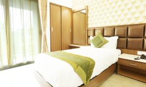Letto o letti in una camera di Treebo Pechis Castle