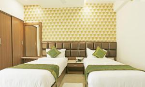 Letto o letti in una camera di Treebo Pechis Castle