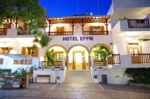 a hotel with a hotel entrance at night at Effie Hotel in Skala