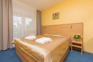 Postel nebo postele na pokoji v ubytování Daina Jurmala Beach Hotel
