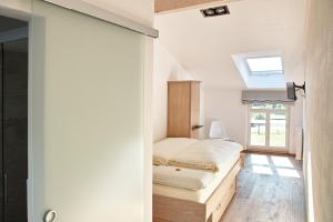 Ein Bett oder Betten in einem Zimmer der Unterkunft Kragemann Hotel & Vinothek