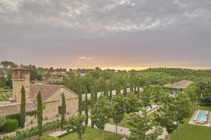 an aerial view of a garden with trees and a building at Hacienda Zorita Wine Hotel & Spa in Valverdón