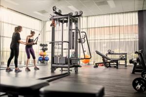 two women are standing in a gym at Van der Valk Zaltbommel-A2 in Zaltbommel