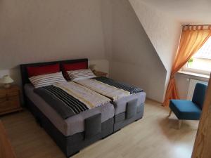 Ein Bett oder Betten in einem Zimmer der Unterkunft Ferienwohnung Haus Rita
