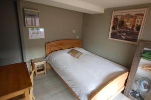 Postel nebo postele na pokoji v ubytování Hotel Piano 2 - Mont-St-Guibert - Louvain-la-Neuve
