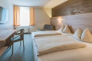 Sporthotel Kapfenberg客房内的一张或多张床位