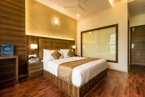 Ένα ή περισσότερα κρεβάτια σε δωμάτιο στο Hotel BKC Inn - Near Trade Center, Visa Consulate BKC