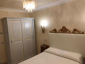 Postel nebo postele na pokoji v ubytování Hotel "La Salute"