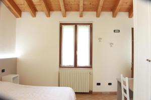 Postel nebo postele na pokoji v ubytování Villa Pasini