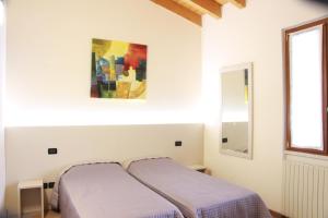 Postel nebo postele na pokoji v ubytování Villa Pasini